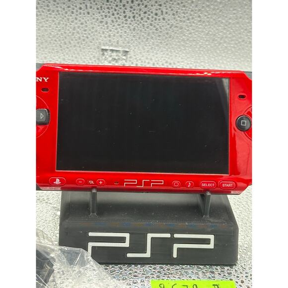 Red and black psp 3000 w/charger adapter, new battery & has glass screen lens - Picture 9 of 9